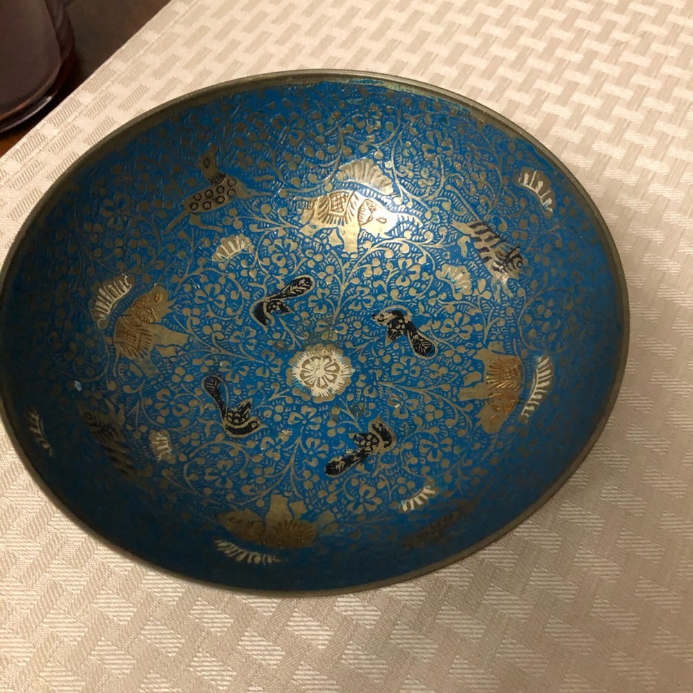 Antique brass bowl adorned with elephants